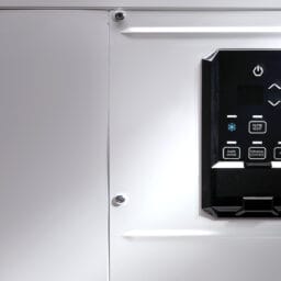 Close-up of Quest 100 dehumidifier showing the digital control panel in dramatic lighting