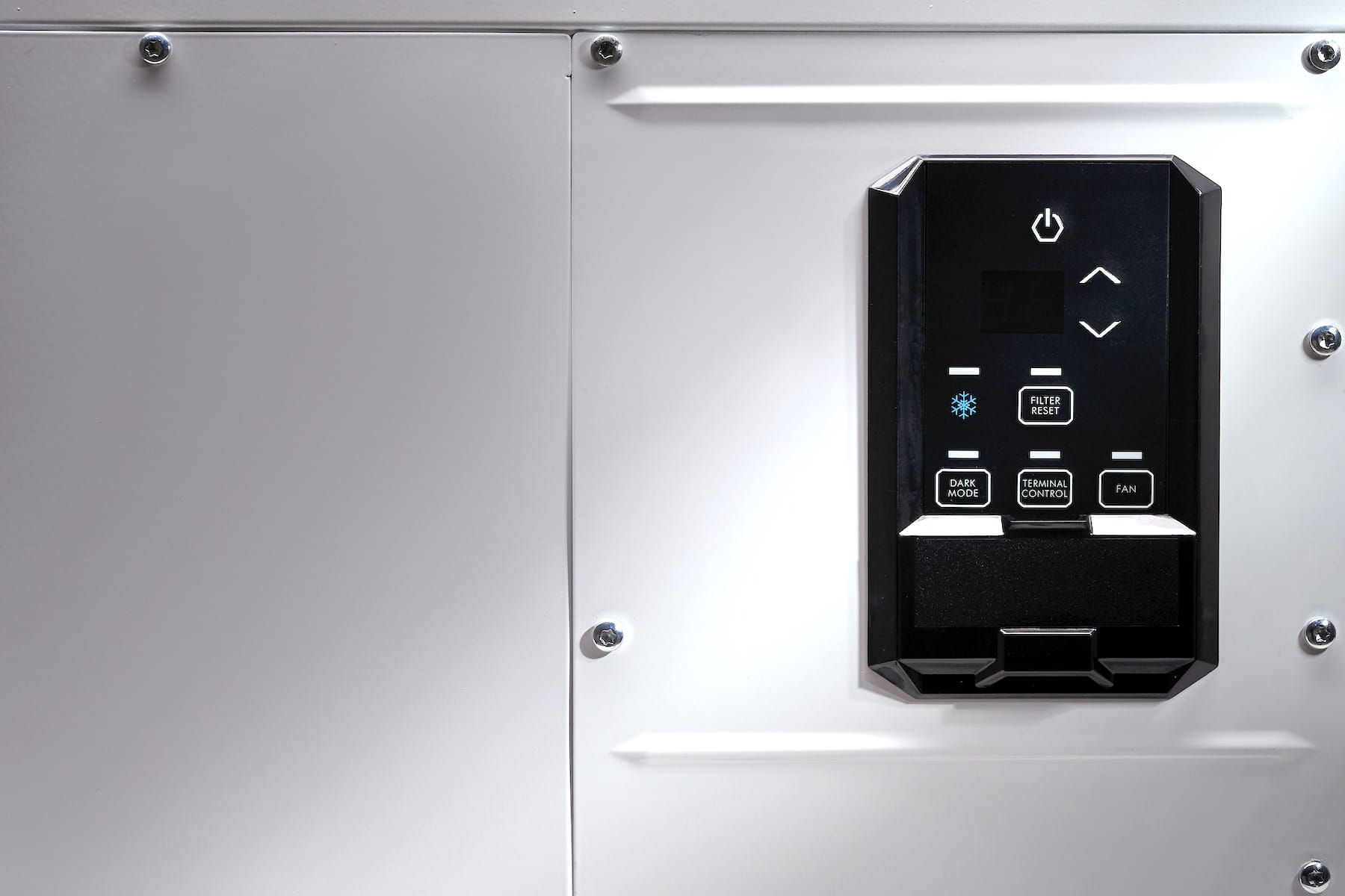 Close-up of Quest 100 dehumidifier showing the digital control panel in dramatic lighting
