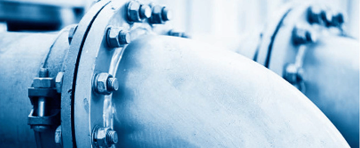 Large industrial water treatment pipe with close up view of bolts holding it together