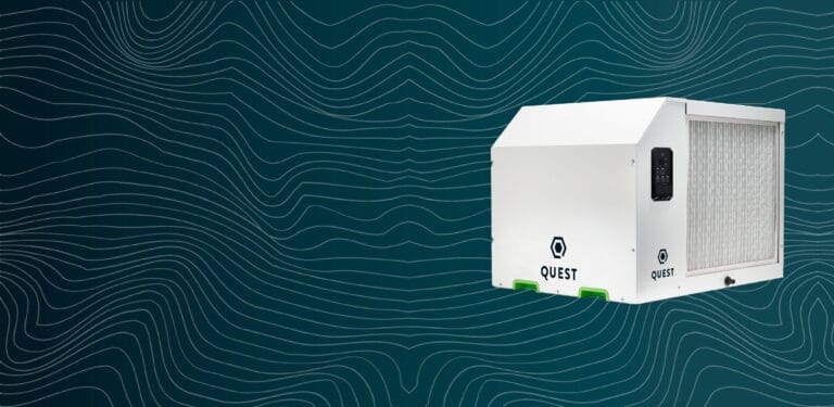 Quest 335 dehumidifier on a dark background with fine lines, depicting airflow
